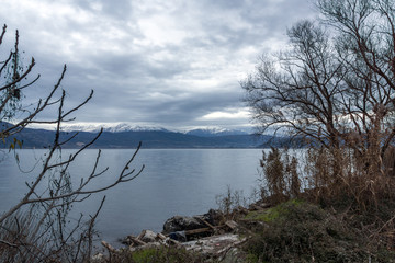 Amazing winter Landscape of Lake Pamvotida and Pindus mountain from city of Ioannina, Epirus, Greece