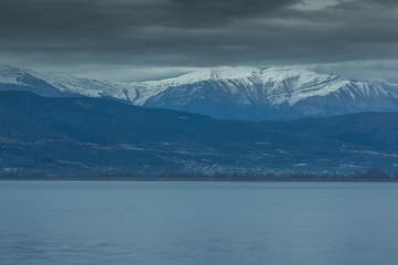 Amazing winter Landscape of Lake Pamvotida and Pindus mountain from city of Ioannina, Epirus, Greece