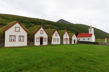 Fototapeta na wymiar Laufáskirkja - Sod Roof Hourses and Church
