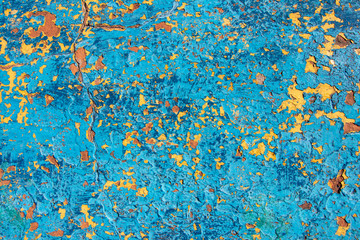 background. original cracked plaster painted in blue and yellow colors