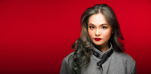 Fashion portrait of Asian Gray curl hair woman with strong color red lips