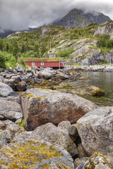 Red wooden house called rorbu at the Lofoten archipelago, Norway