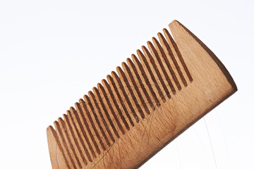 Lost hair in wooden brush comb