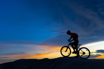 Fototapeta na wymiar Silhouette of cyclist in motion