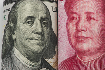 US dollar bill and Chinese yuan banknote. USD vs RMB.