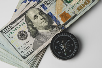 Compass and money. US banknote. Financial concept.