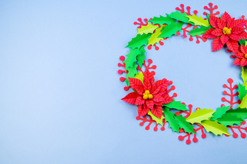 Christmas wreath of paper flowers poinsettia