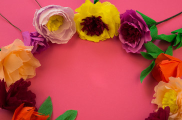 making crepe paper flowers on pink background