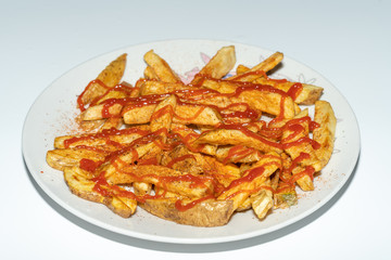 French fries with salt, paprika and ketchup