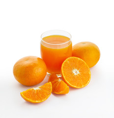 A glass of orange juice and an oranges isolated on white background 