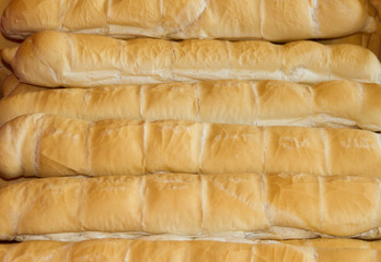 background of baked wheat flour breads in the field