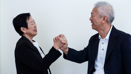 Happy smile Asian elderly couple in business attire, SME owner