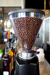 Coffee grinder fully with roasted coffee beans