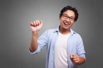 Fototapeta premium Young Man Happy, Celebrating Victory Gesture