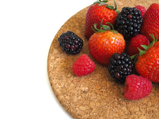 Fresh strawberry, raspberry and blackberry on wooden background, healthy food and diet.