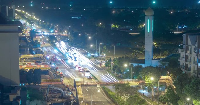 Traffic signal cars stopping and moving timelapse video clip at night, Singapore
