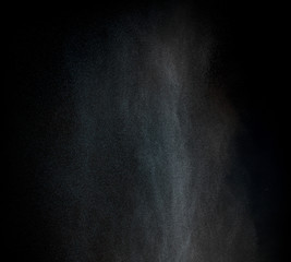Dust particles over black background