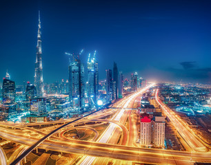Colourful nighttime skyline of Dubai, United Arab Emirates. Travel background.