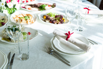 Wedding decorated table. Luxury light decor on table in restaurant	