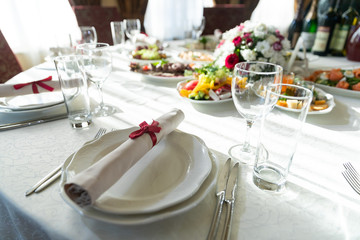 Wedding decorated table. Luxury light decor on table in restaurant	