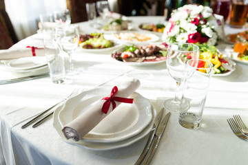 Wedding decorated table. Luxury light decor on table in restaurant	