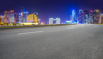 Urban road asphalt pavement and skyline of Hangzhou architectural landscape