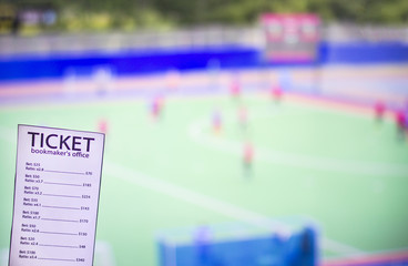 Bookmaker ticket on the background of the TV, which shows hockey on the grass, sports betting, bookmaker ticket, lawn hockey