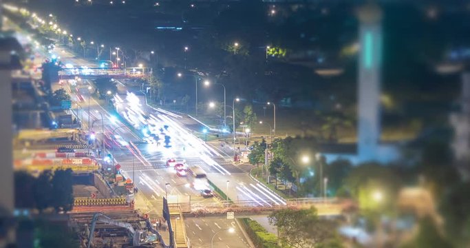 Traffic signal cars stopping and moving timelapse video clip at night, Singapore