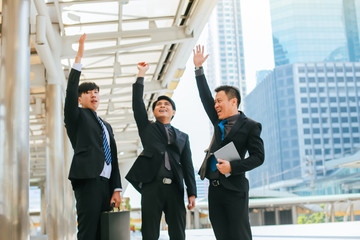 Fototapeta premium Group of businessmen stand talking about working with joint projects.They can work together and succeed very well.