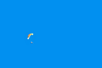 Paraplane in the blue sky.