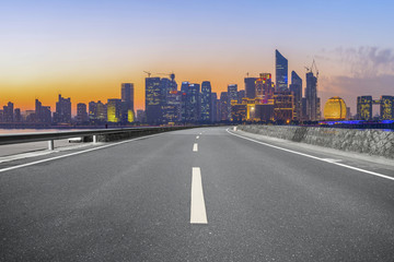 Urban road asphalt pavement and skyline of Hangzhou architectural landscape