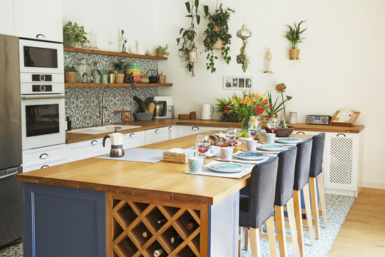 Fresh Summer Breakfast In Mediterranean Style Kitchen.  Bright And Sunny Space With A Lot Of Herbs And Plants.