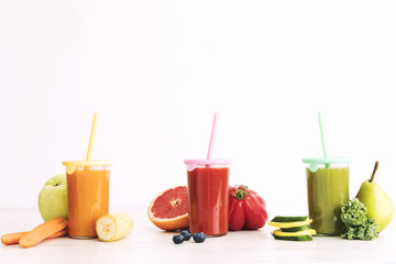 Composition of healthy detox juices and smoothies with seeds. Healthy vegetables and fruits on the white background, copy space