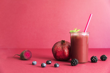 Healthy red smoothie with red vegetables and fruit lie on the table. Detox diet for healthy body and mind.
