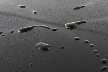 drops of water on a black surface