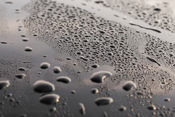 drops of water on a black surface