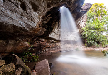 Fototapeta na wymiar Amazing Thailand the hole waterfall shape heart .Sangchan waterfall. Pha Taem National Park, Ubonratchathani, Thailand