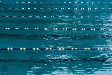 swimming-pool with blue water for sporting swimming with tracks