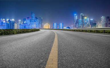 Urban road asphalt pavement and skyline of Hangzhou architectural landscape