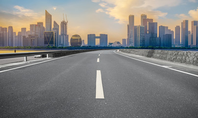 Fototapeta premium Urban road asphalt pavement and skyline of Hangzhou architectural landscape