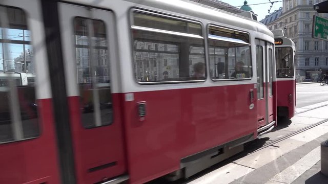 City tram is riding intersection in the center of capital of Austria, Vienna city