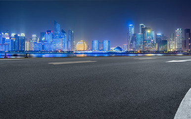 Urban road asphalt pavement and skyline of Hangzhou architectural landscape