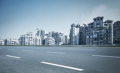 Modern city and asphalt highway, blue tones