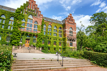 The building of the University Library in Lund, Sweden. The building of architecture overgrown with...
