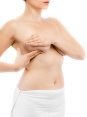 Naklejka premium Woman examining breast isolated on white background 
