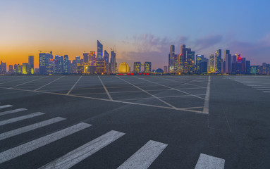 Urban road asphalt pavement and skyline of Hangzhou architectural landscape