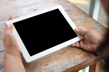 Hand holding modern smartphone with big blank screen design,  isolated on black background for insert image, data or etc.