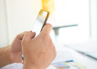 Hand holding modern smartphone and feed some data