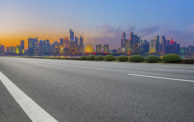 Urban road asphalt pavement and skyline of Hangzhou architectural landscape