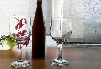 two glasses and a bottle